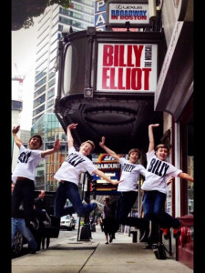 Ben Cook celebrates with other members of the Billy Elliot cast in New York.