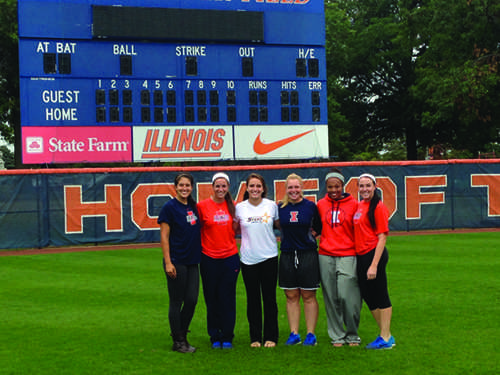 Freshman Patty Ohanian poses with softball players from the University of Illinois.