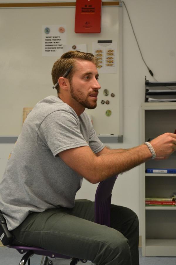 Systems of Support Adviser Brett Garner meets with teachers. 
