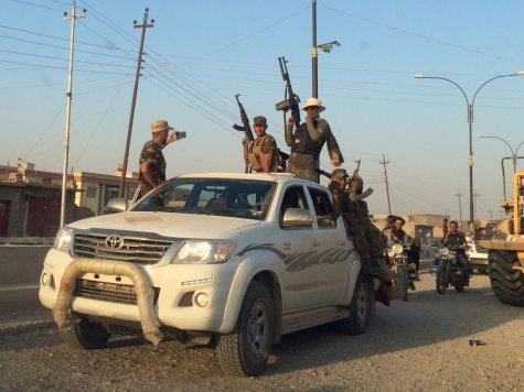 Shiite militiamen loyal to radical cleric Muqtada Sadr enter Amirli, Iraq, on Monday, Sept. 1 after helping to liberate the town from a nearly three-month siege by Islamic State militants.