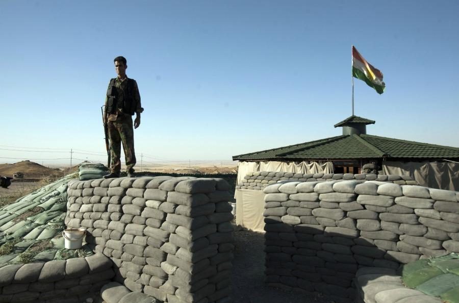 Kurdish Peshmerga fighters along a frontline position protect the main highway between Kurdish occupied Kirkuk and the capital of the Kurdish Regional Government in Irbil. 