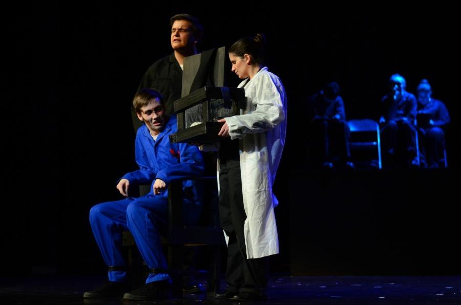 Senior Levi Meerovich portrays O'Brien in the LBT production of 1984 as he prepares to torture Winston Smith (portrayed by senior Liam Finn) with rats.