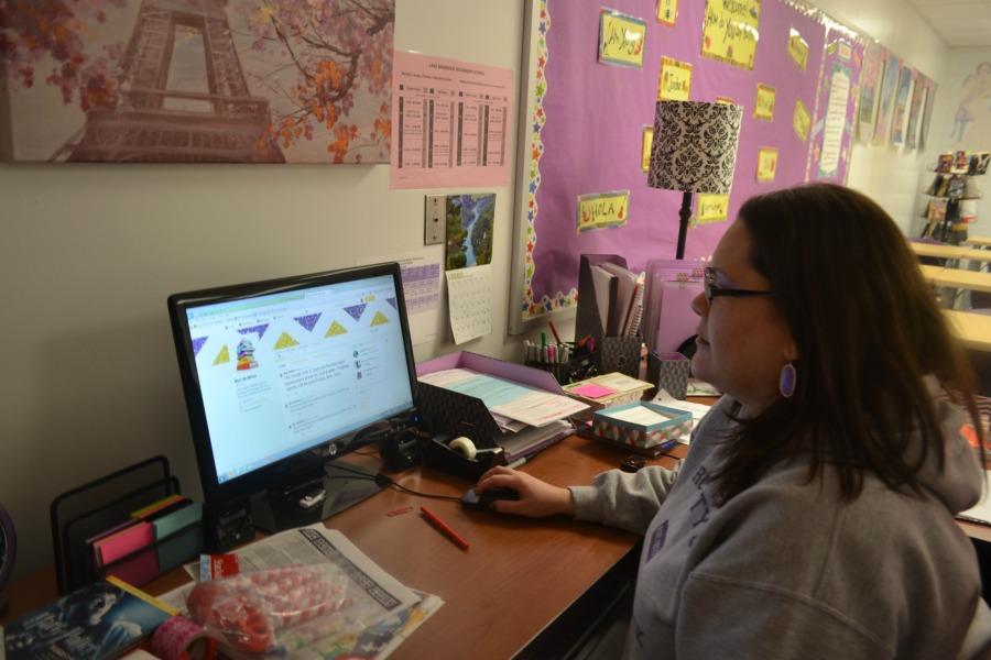 English teacher Kelly McMillan scrolls through her Twitter page. 