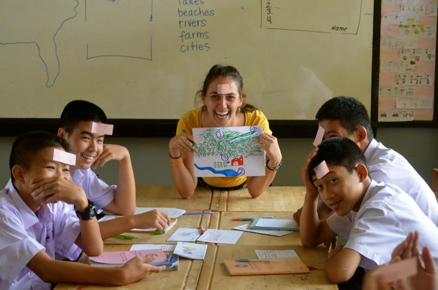A group of students work with Sands as she teaches them English through games and group interactions.