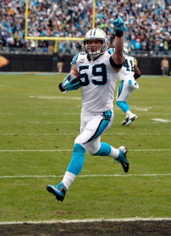 Carolina Panthers' Luke Kuechly (59) celebrates as he returns an interception for a touchdown during the first quarter on Sunday, Jan. 17, 2016, at Bank of America Stadium in Charlotte, N.C. (David T. Foster III/Charlotte Observer/TNS)