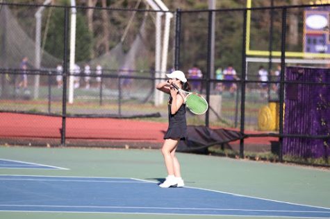 Josephine Ha returns a serve at the match against West Potomac. Photo courtesy of Khoi Truong