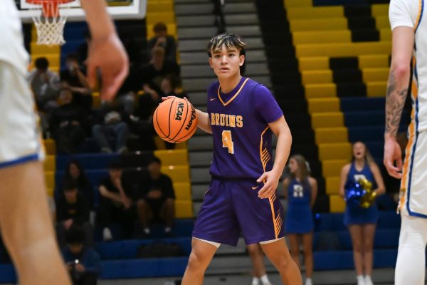 Junior Dean Johnson competes in a game against Robinson on December 17th, resulting in a win for the Bruins